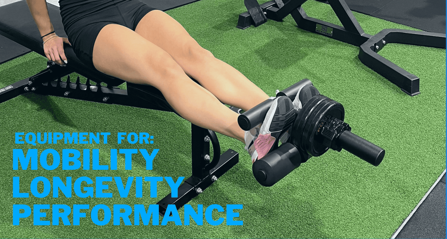 A person using equipment designed for mobility, longevity, and performance, highlighting fitness techniques on a gym bench with a green turf floor.