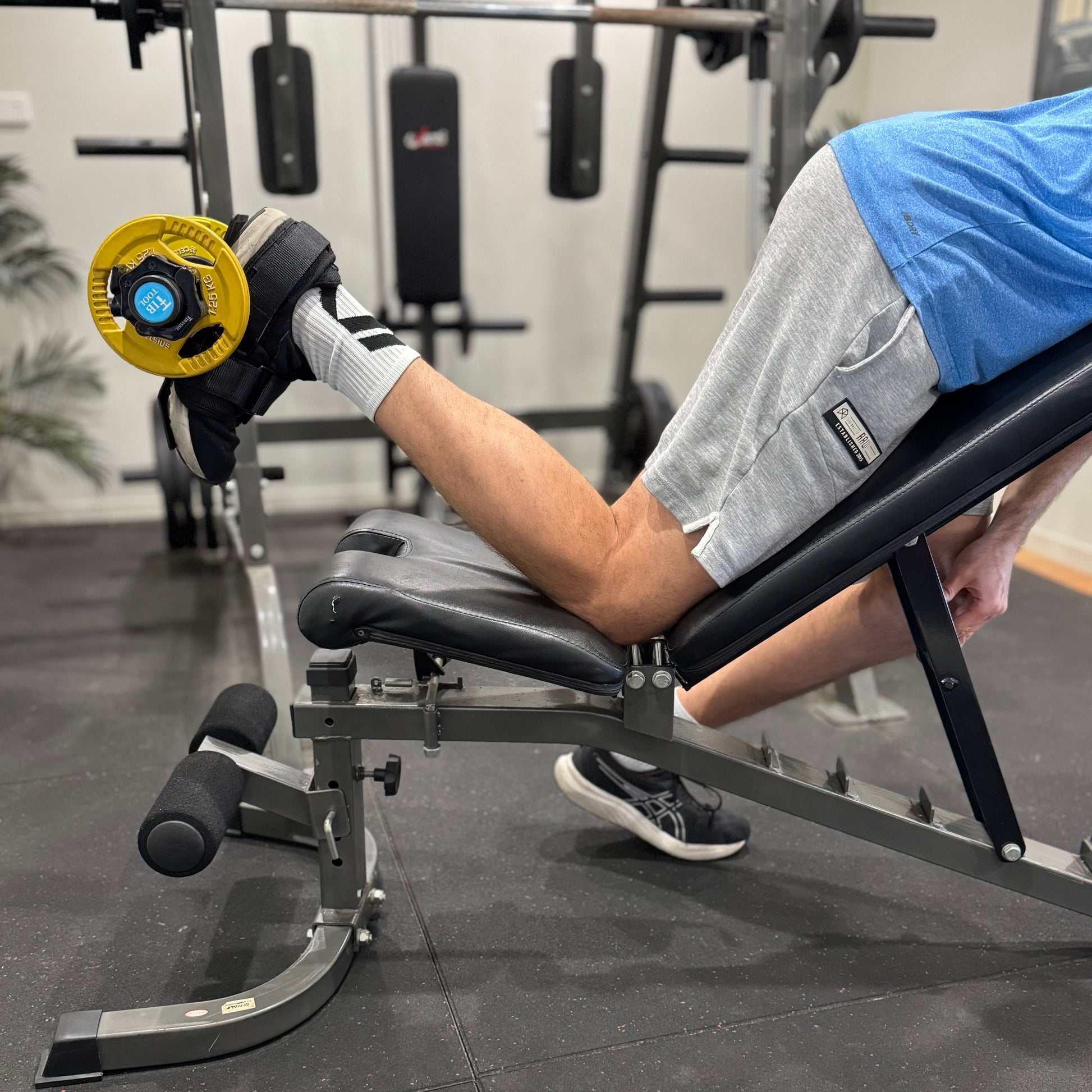 Using tib bar attachment for training hamstrings.
