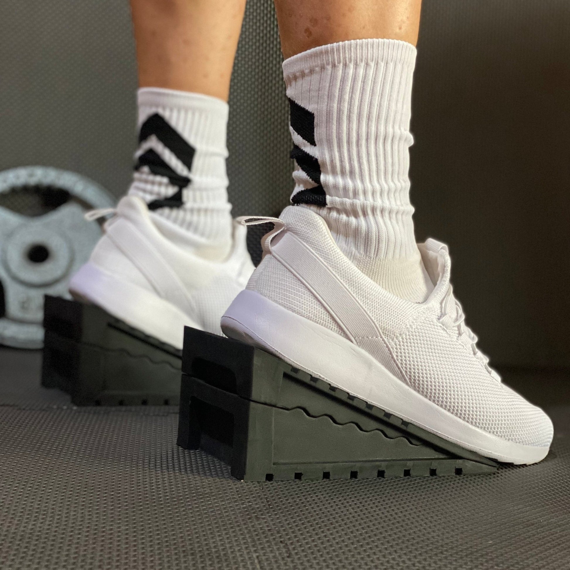 Squat Wedge - The Tib Tool, Tib Bar, Kneesovertoesguy, knee rehab, plantar fasciitis, tib raises, slant board, ankle mobility, tib bar, tibialis, shin splints, knees over toes guy, knee rehab, tib tool, athletic truth group, ATG, tib trainer, squat wedge, slantboard