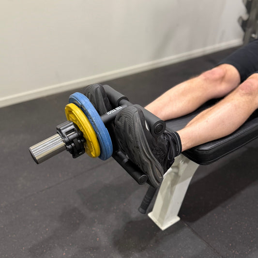 Tib Bar raises on a bench.