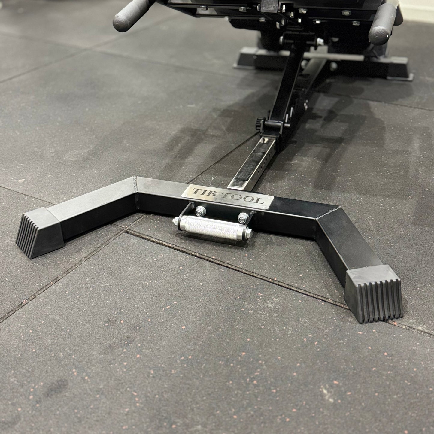 Black metal Nordic Bench Back extension on a concrete floor with 'Tib Tool' branding.