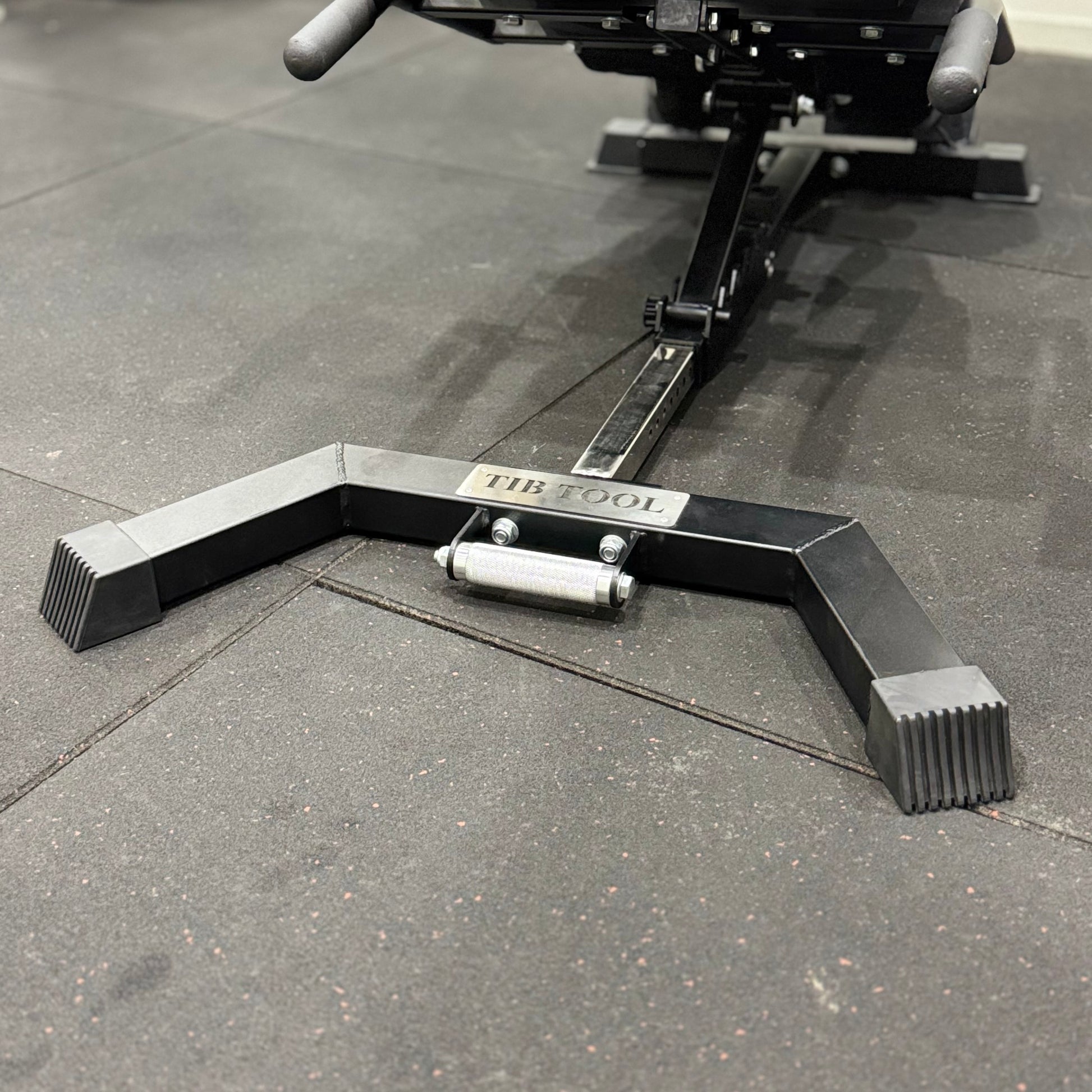 Black metal Nordic Bench Back extension on a concrete floor with 'Tib Tool' branding.
