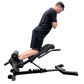 Person using a black weight Nordic curl bench on a white background
