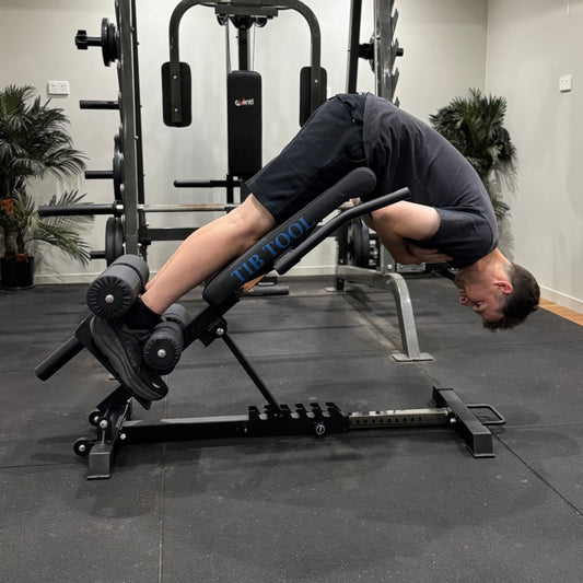 Person using a gym machine in a fitness setting