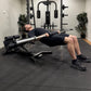 Person performing hip thrusts with a barbell in a gym setting. 
