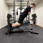 Person performing Nordic curls on an adjustable Nordic bench.