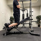 Person using a nordic curl machine in a gym setting
