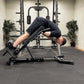 Person using a Nordic back extension weight bench in a gym setting.