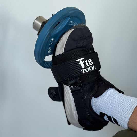 Using a tib bar at end of gym bench, home gym