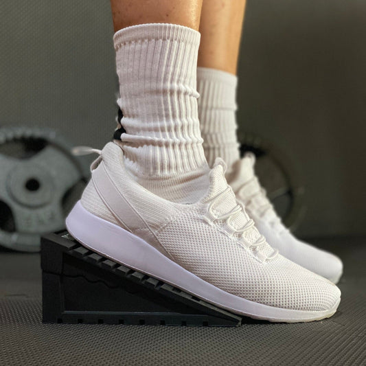 Squat Wedge - The Tib Tool, Tib Bar, Kneesovertoesguy, knee rehab, plantar fasciitis, tib raises, slant board, ankle mobility, tib bar, tibialis, shin splints, knees over toes guy, knee rehab, tib tool, athletic truth group, ATG, tib trainer, squat wedge, slantboard